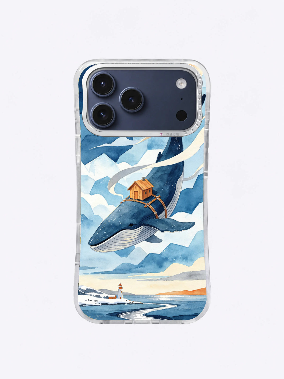 Blue whale above a lighthouse and winding winter coast phone case design