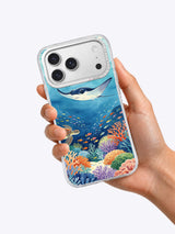Hand holding a clear iPhone case printed with Ocean Gathering marine art