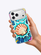 Hand holding an iPhone case with coral scallop and turquoise comic-wave art