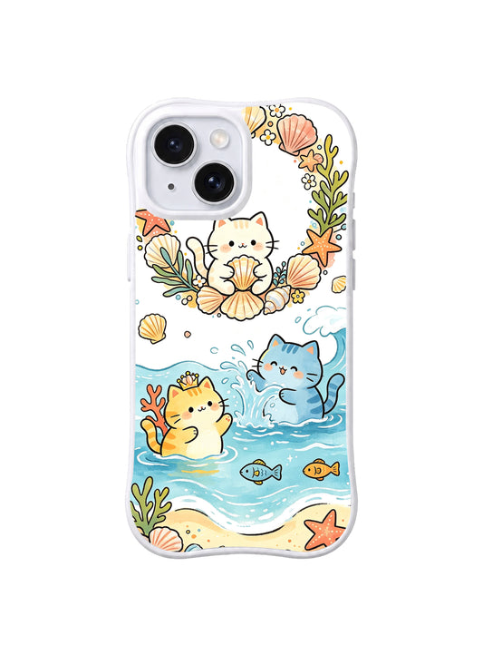Shell Cove Cat Friends: Cream, yellow and blue cats sit among shells, seaweed, fish and curling turquoise waves.