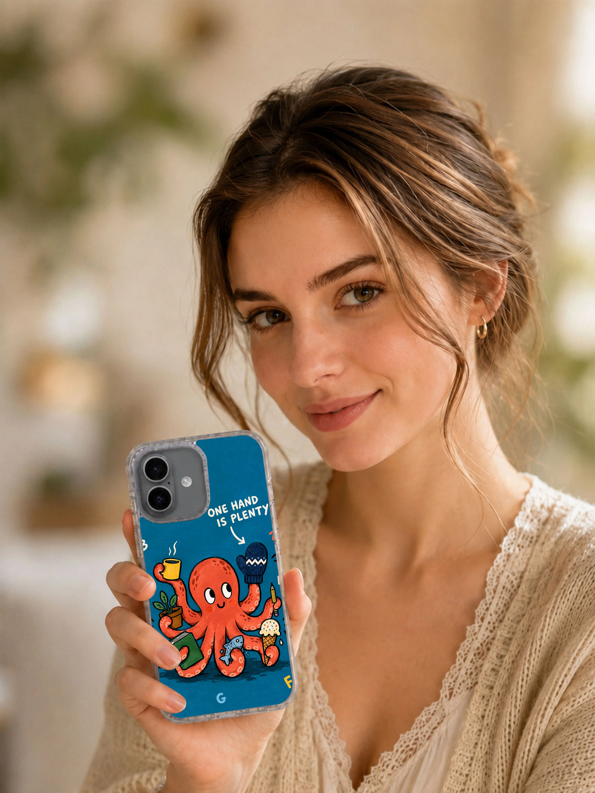 Lifestyle view of One Hand Is Plenty octopus iPhone 16 case