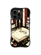 Open Book Candle Alcove pattern on a black iPhone 14 Pro case with a large blank book, spectacles, gold candleholder, keys, stars and burgundy library shelves