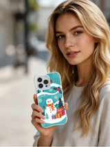 Lifestyle view of The Ornament Snowman clear-edge iPhone 15 Pro case held outdoors