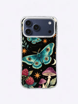 Moonwing Ochre Starflight pattern with a teal fantasy moth, ivory crescent, raspberry flowers, mushrooms, and orange stars