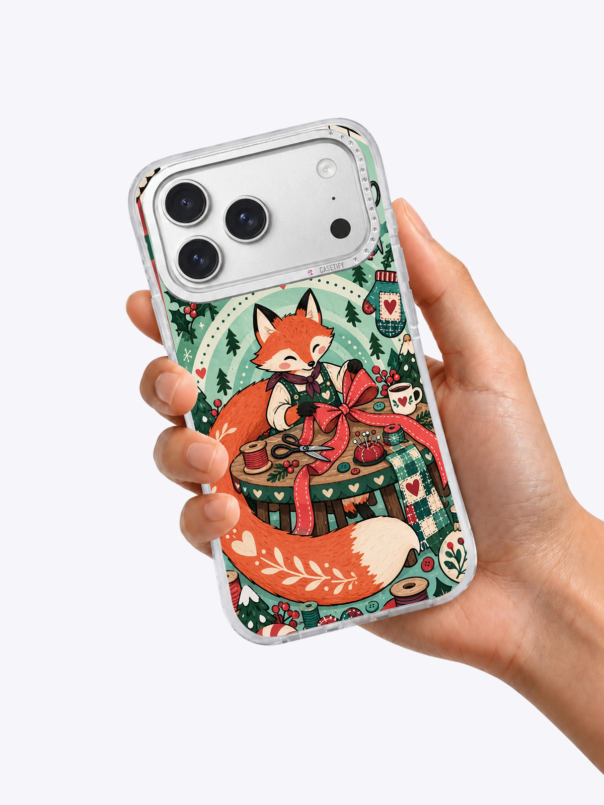 Peppermint Tailor Fox iPhone 17 Pro Max case in hand