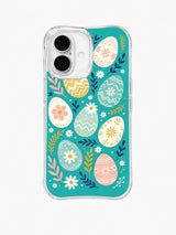 Petal Egg Waltz / Pastel Egg Garden: Large cream, pink, mint and mustard eggs with flower and zigzag motifs among short navy and pink leafy branches.