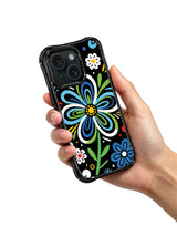 Colorful flower art iPhone 15 Pro case held in hand