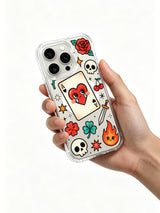 PhoneCasing iPhone 15 pro Case ace heart paired with crossbones skull, bottom dual flames, cherry sprig and single clover detail, premium clear art iPhone 15 pro casing.