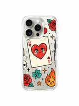 PhoneCasing iPhone 15 pro Case featuring vertical lipstick beside ace heart card, dual bottom flames, rose cluster and skull & bones detail, premium glossy finish wearable art phone casing.