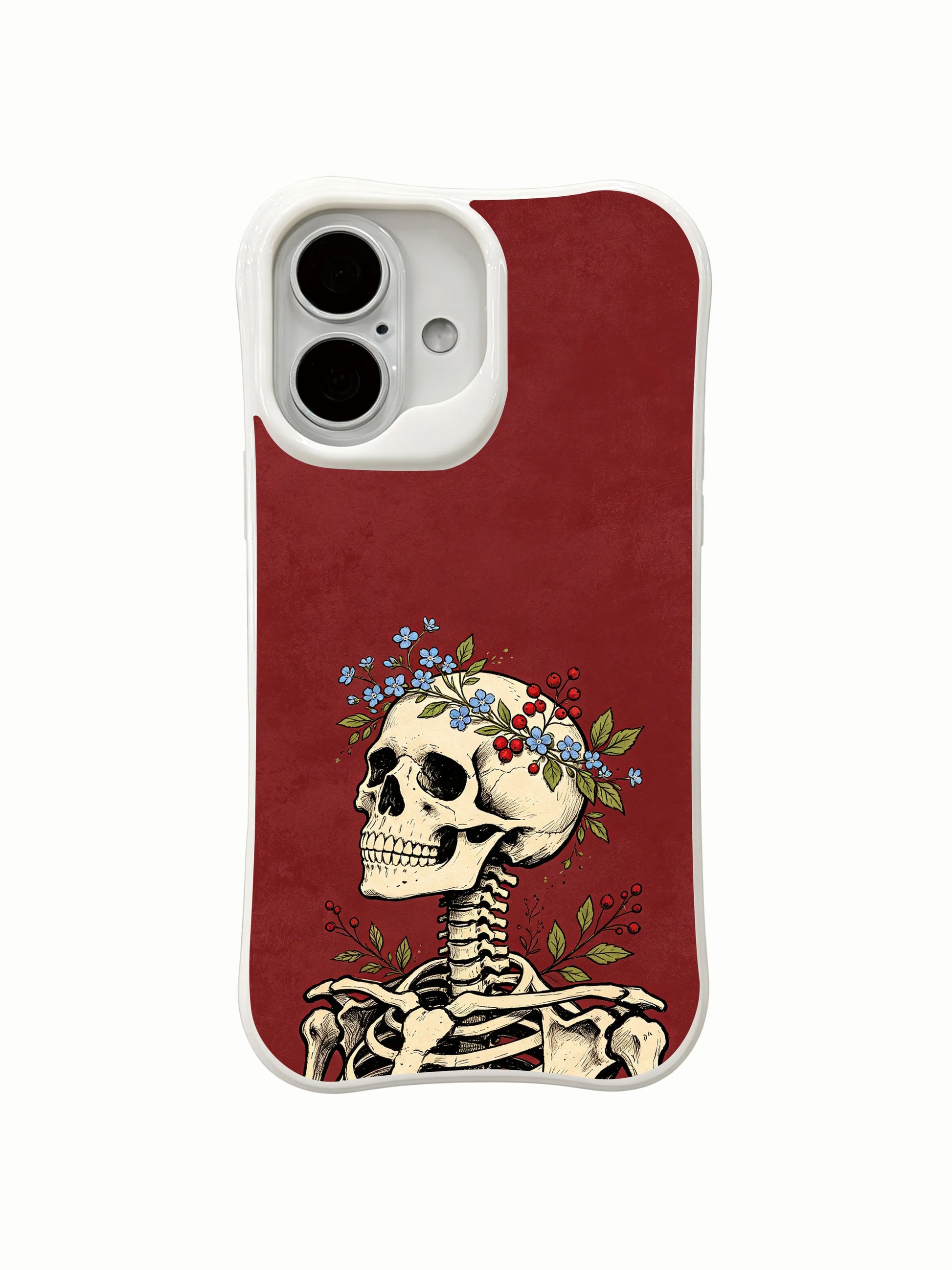 PhoneCasing berry & forget-me-not spiritual skull iPhone 16 Case, assorted blue wildflower crown on antique bone skull, fade resistant durable daily-use iPhone 16 casing