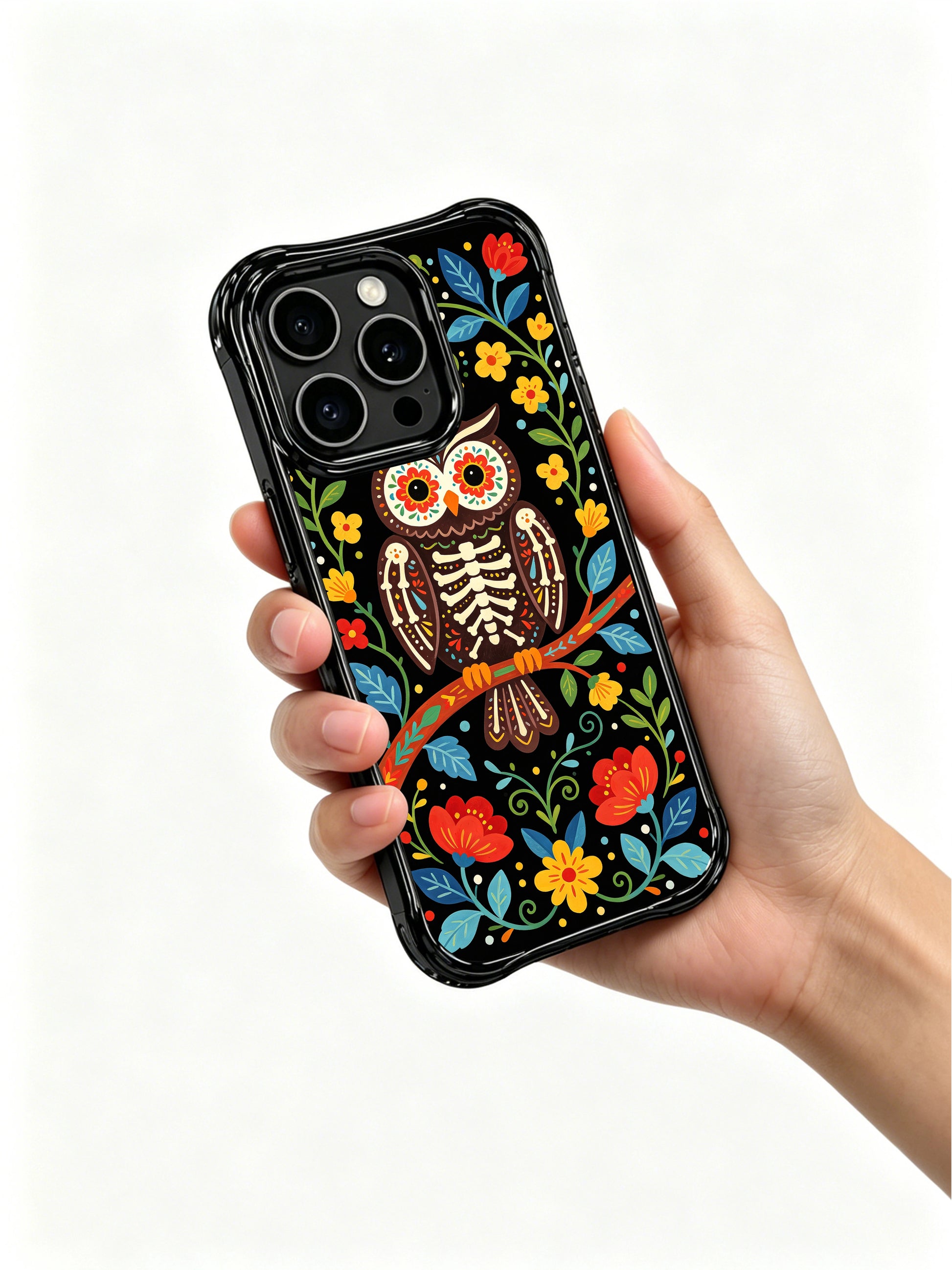 PhoneCasing iPhone 16 pro max Case featuring a skeleton owl with intricate blue and red patterns on its wings, perched on a branch surrounded by folk flowers, balanced folk art design for iPhone 16 pro max casing.