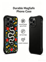 PhoneCasing iPhone 16 pro max Case featuring a coiled bone snake skeleton with red roses growing through its form, set against a black background with blue leaves and yellow flowers, whimsical folk design for iPhone 16 pro max casing.