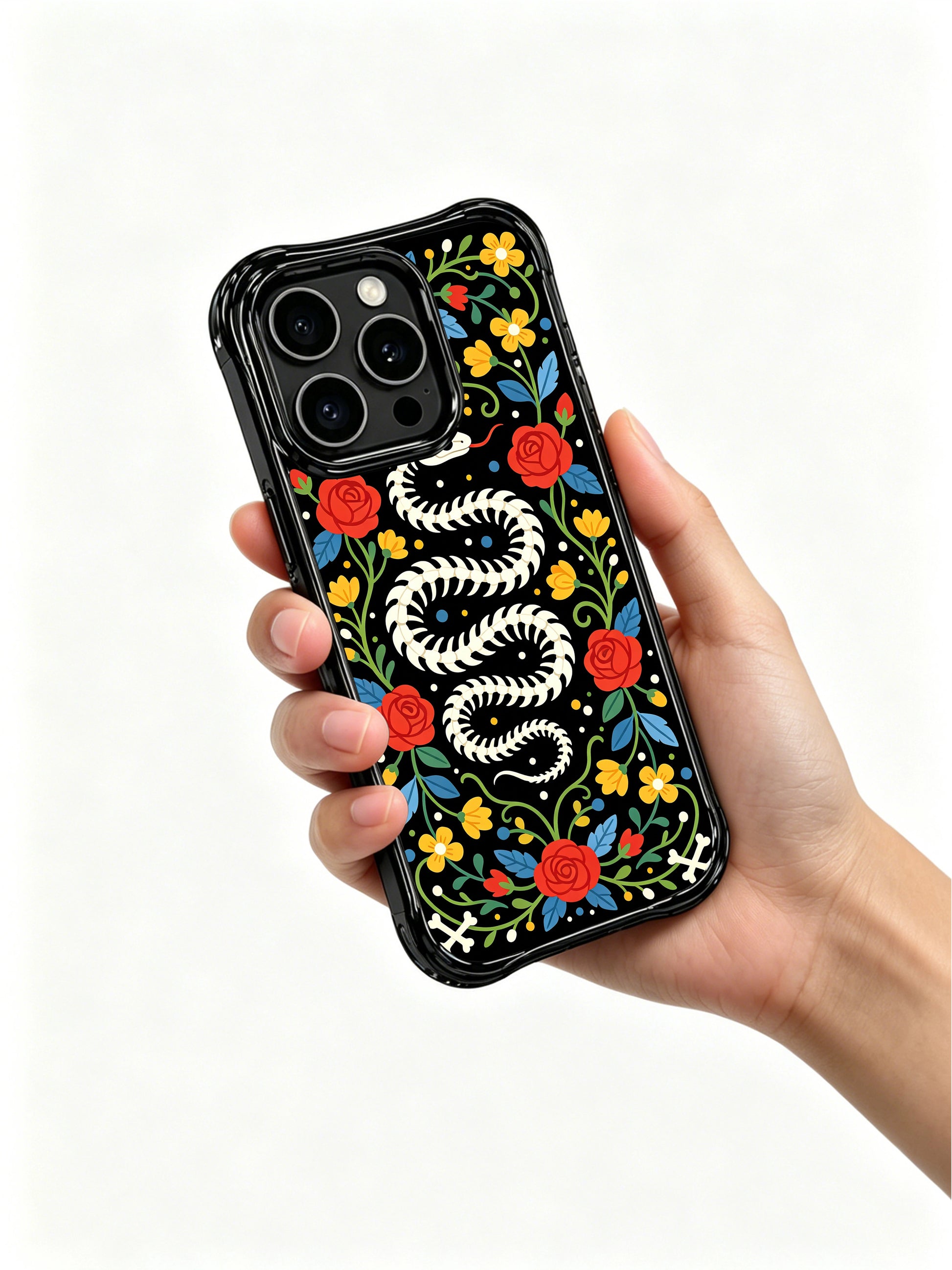 PhoneCasing iPhone 16 pro max Case featuring a coiled bone snake skeleton surrounded by bright yellow flowers, red roses and blue leaves, creating a vibrant folk art border around the design, balanced folk art design for iPhone 16 pro max casing.