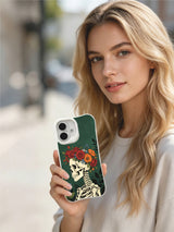 PhoneCasing Bones As Wild Sanctuary morbid botanical iPhone 16 Case, exclusive Morrigan Vale art with tranquil skeleton wearing multi-tone floral crown, UV-printed custom printed protective iPhone 16 cover