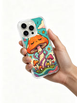 Wildflowers and grass beside a sleeping mushroom artwork on an iPhone 16 Pro Max case