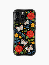 PhoneCasing iPhone 16 pro max Case featuring sugar skull butterflies with detailed floral skulls on their wings, surrounded by red roses, yellow blooms and green foliage, whimsical folk design for iPhone 16 pro max casing.
