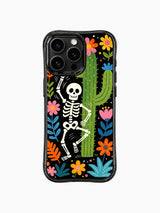 PhoneCasing iPhone 16 pro max Case with a dancing skeleton surrounded by pink, orange and blue desert flowers, tropical leaves framing the design, folk fantasy art on black iPhone 16 pro max casing.