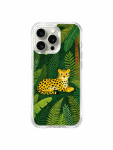 Dappled Calm: A small reclining cat set low among tall, layered leaves.