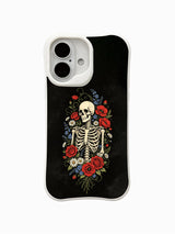 PhoneCasing Eternal Night Bloom fine art iPhone 16 Case, original Morrigan Vale old-school traditional tattoo artwork featuring full upright skeleton wrapped in vivid red rose, poppy, daisy & tiny blue wildflowers on textured vintage black backdrop, scratch resistant glossy casing manufactured in California