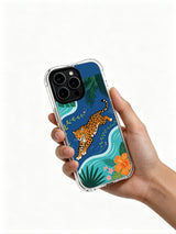 UV-printed artist-designed iPhone 13 pro Case by PhoneCasing, dynamic forward-leap orange jaguar surrounded by seaside palm & monstera leaves durable phone cover, multi-shade tropical blossom luxury wearable art casing