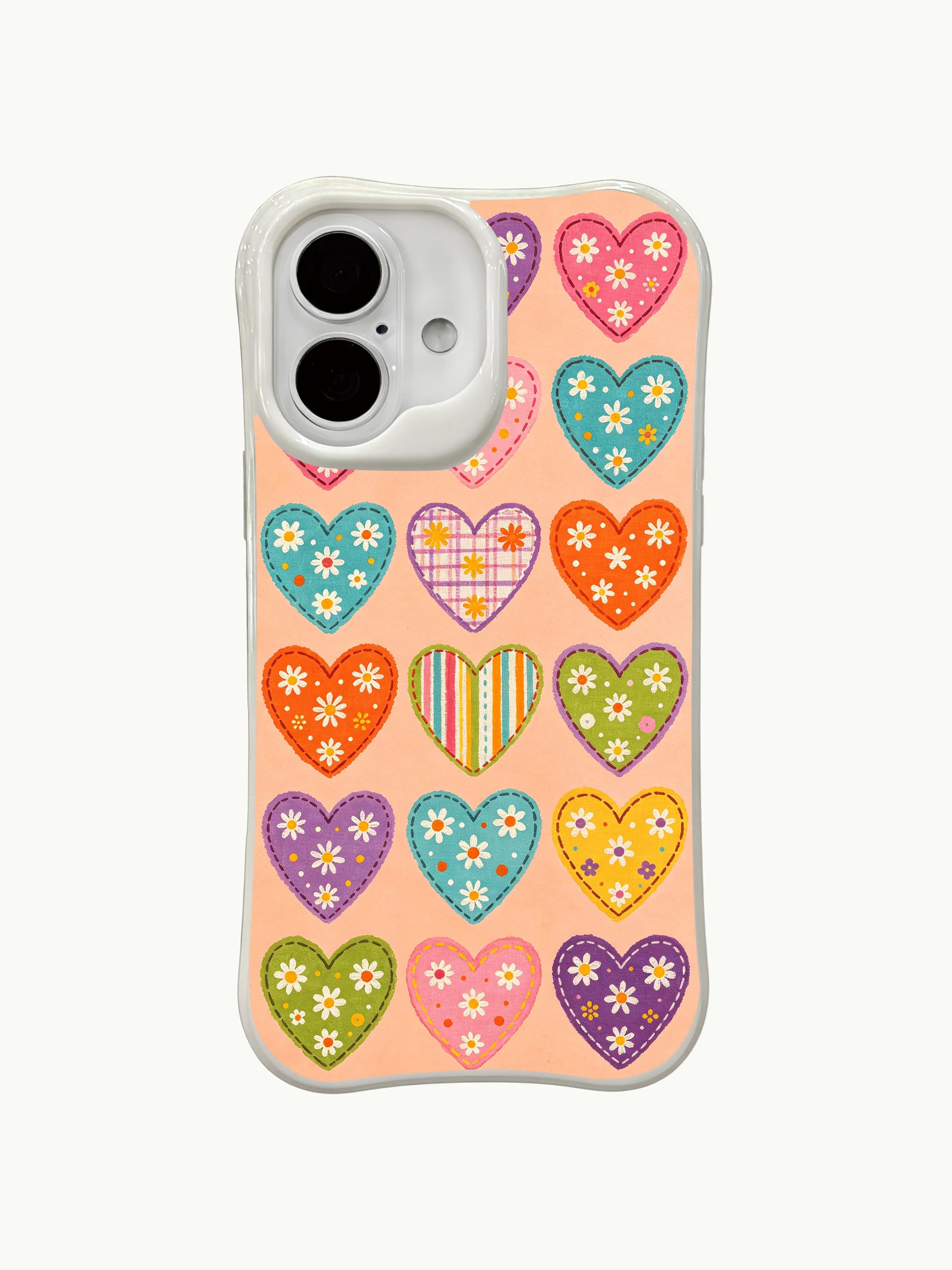 PhoneCasing handmade-style hearts iPhone 16 plus case, stitched heart appliques with daisy and dot details, premium iphone 16 plus casing.