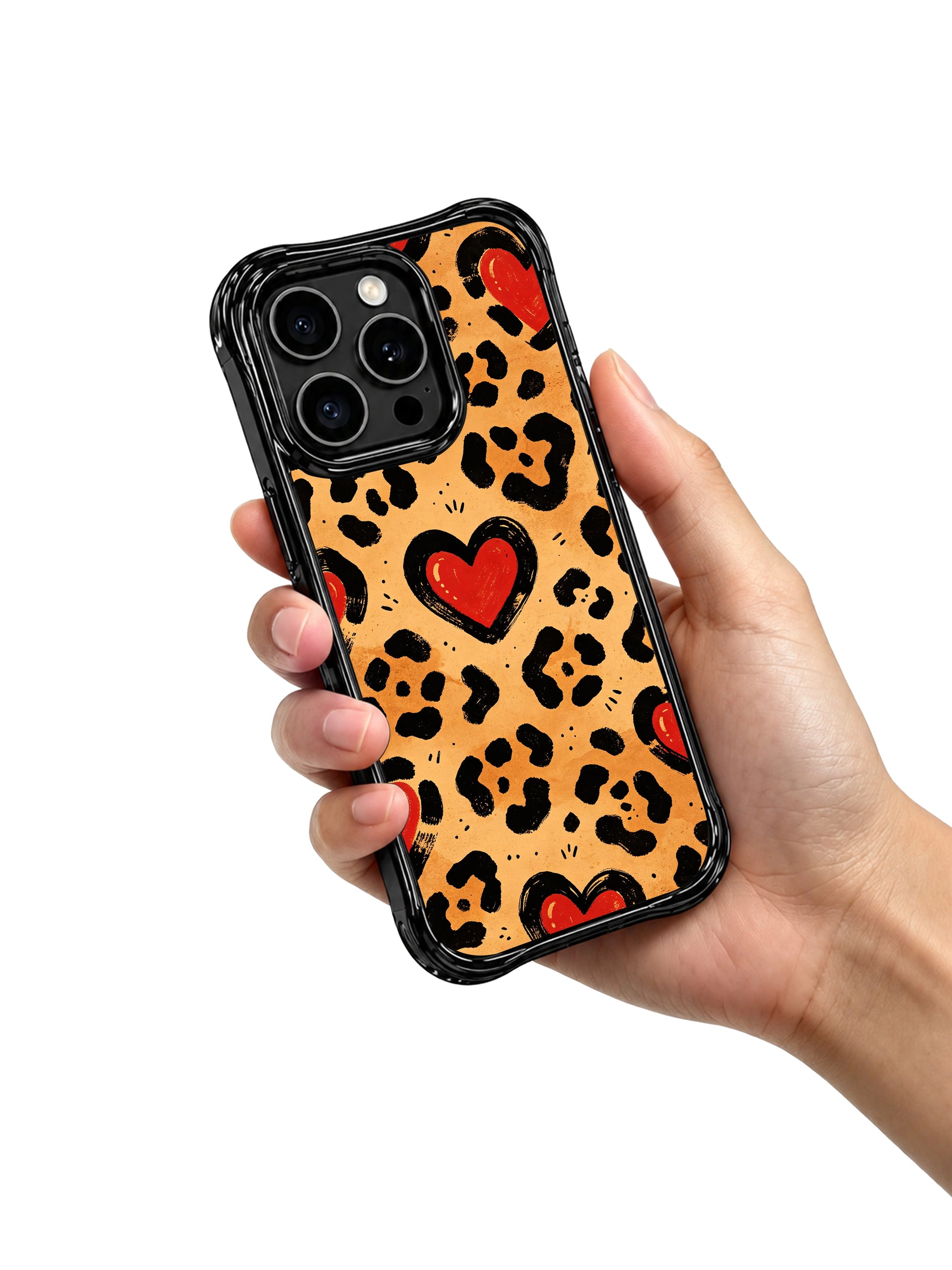 PhoneCasing iPhone 14 Pro Case flat studio shot of vintage desert-toned leopard heart print. Warm tan caramel base, hand-doodled western embroidery red hearts, rugged black spotted animal pattern, limited wearable art case.