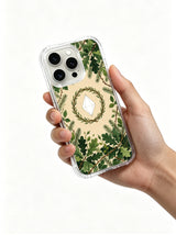 Minimal botanical wreath with diamond artwork on an iPhone 15 Pro case