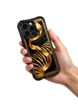 honeCasing iPhone 15 pro max back cover featuring Aurelia Wilden's signature flowing black gold ribbon and hidden leopard print, museum-quality art phone case.
