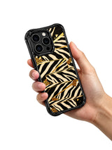 PhoneCasing iPhone 15 pro max back cover detail, showing thin metallic gold foil seam lines between zebra staircase blocks, premium art phone casing.