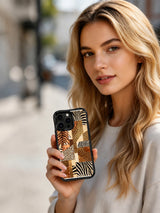 PhoneCasing iPhone 15 pro max case from the Wild Gilded Safari collection, bronze tiger weave design, bold warm artistic phone cover.