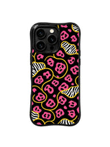 PhoneCasing iPhone 15 pro max cover in low night light, showing dramatic contrast between deep black and bright rose pink leopard, romantic fun phone case.