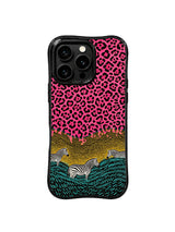 PhoneCasing iPhone 15 pro max cover in bright natural light, showing saturated hot pink and deep black pop art color, bold statement phone case.