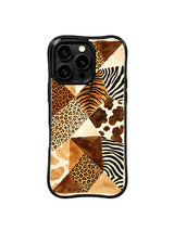 PhoneCasing iPhone 15 pro max cover in casual lifestyle setting, showing leopard patchwork print paired with denim, everyday wearable art phone case.