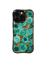 PhoneCasing premium iPhone 15 pro cover compatible with iPhone 15 pro max, held in hand showing dreamy turquoise gold beast print design, non-slip exotic luxury phone casing.