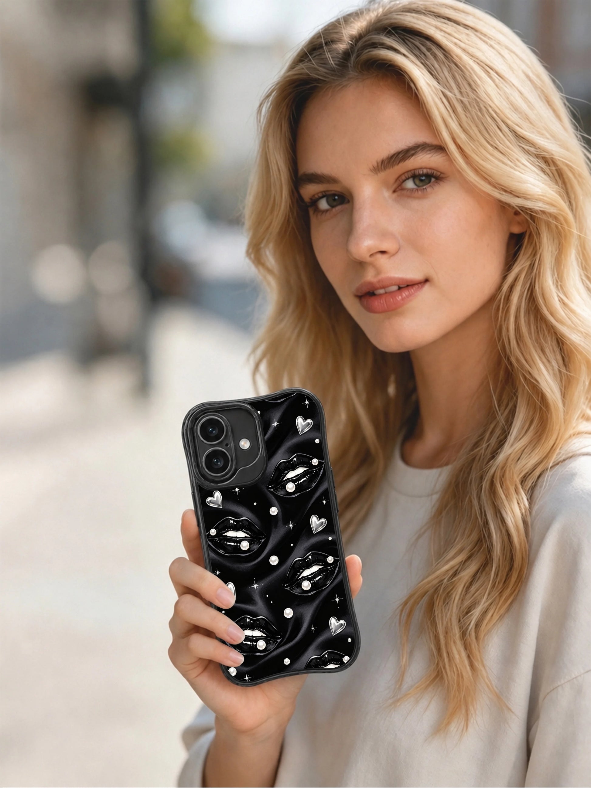 PhoneCasing iPhone 16 case with black satin lip cover artwork, pearl embellishments, and subtle star sparkle for an iPhone 16 Pro case inspired look.