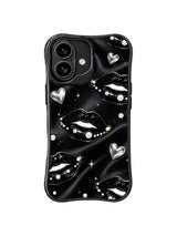 PhoneCasing iPhone 16 case with chrome heart kiss details, black lips, pearl accents, and a sleek iphone 16 cover mood.