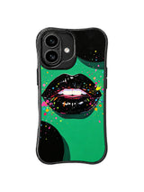 PhoneCasing iPhone 16 case with Emerald Night pop casing artwork, black lacquer lips, oversized dots, and bright splatter details.