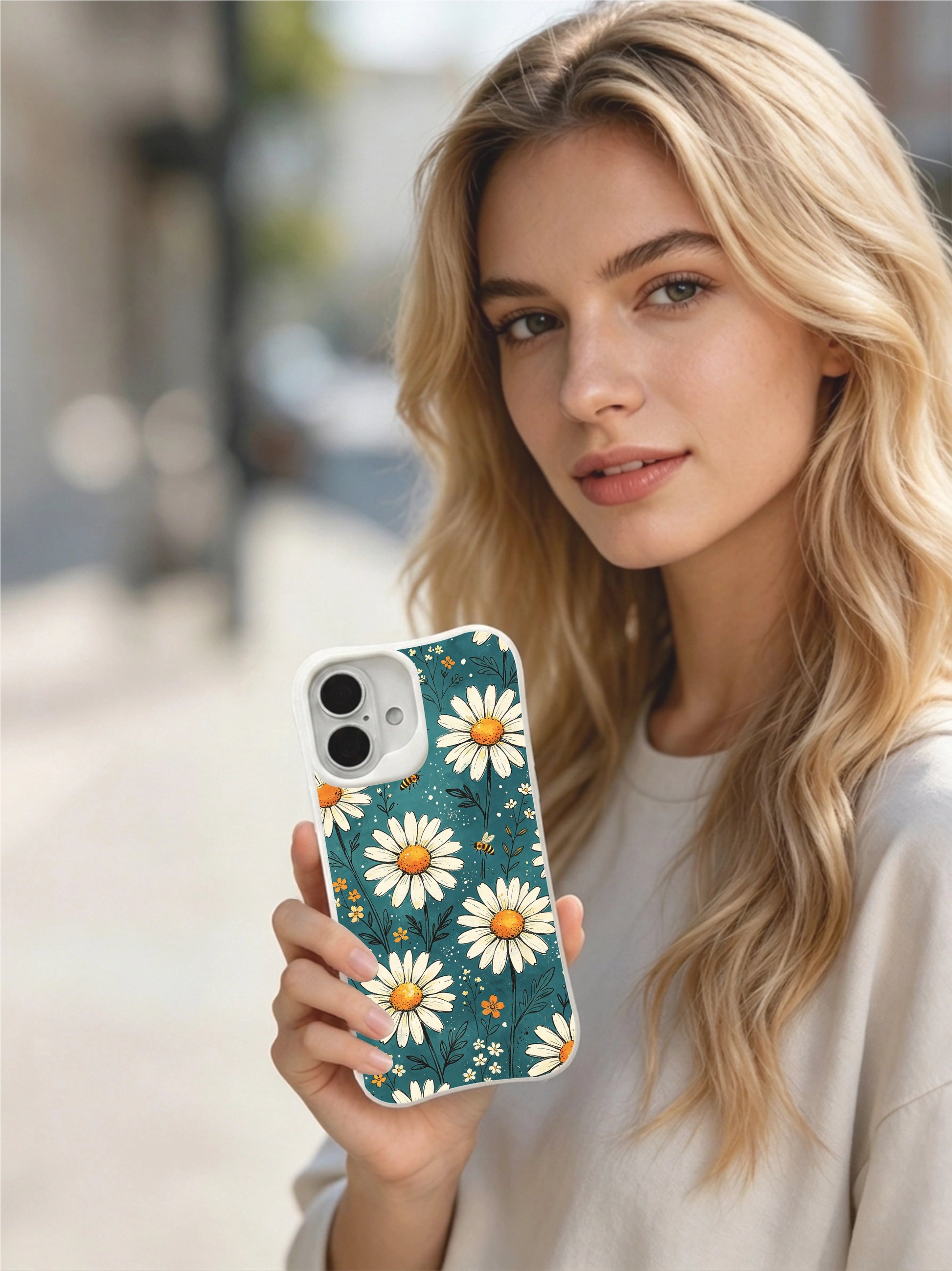 Lively Floral Bees art by Mira Bloomwell on this PhoneCasing iPhone 16 Plus Case, with scratch-resistant, antimicrobial gloss finish.