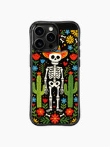 Folk art skeleton in a sombrero with cacti and flowers on PhoneCasing iPhone 16 pro max case, Day of the Dead design with black background.