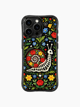 Folk art skeleton snail with flowers on PhoneCasing iPhone 16 pro max case, Day of the Dead design with black background.