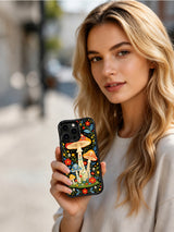 Midnight Fantasy Mushroom Grove artwork on an iPhone 16 Pro Max case