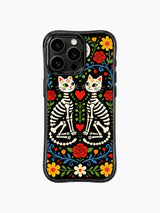 Twin sugar skull cats with red hearts on PhoneCasing iPhone 16 pro max case, whimsical Day of the Dead design with colorful flowers.