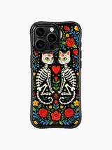 Vibrant Day of the Dead twin skeleton cats on PhoneCasing iPhone 16 pro max case, folk art style with sugar skull faces and floral patterns.Vibrant Day of the Dead twin skeleton cats on PhoneCasing iPhone 16 pro max case, folk art style with sugar skull faces and floral patterns.v