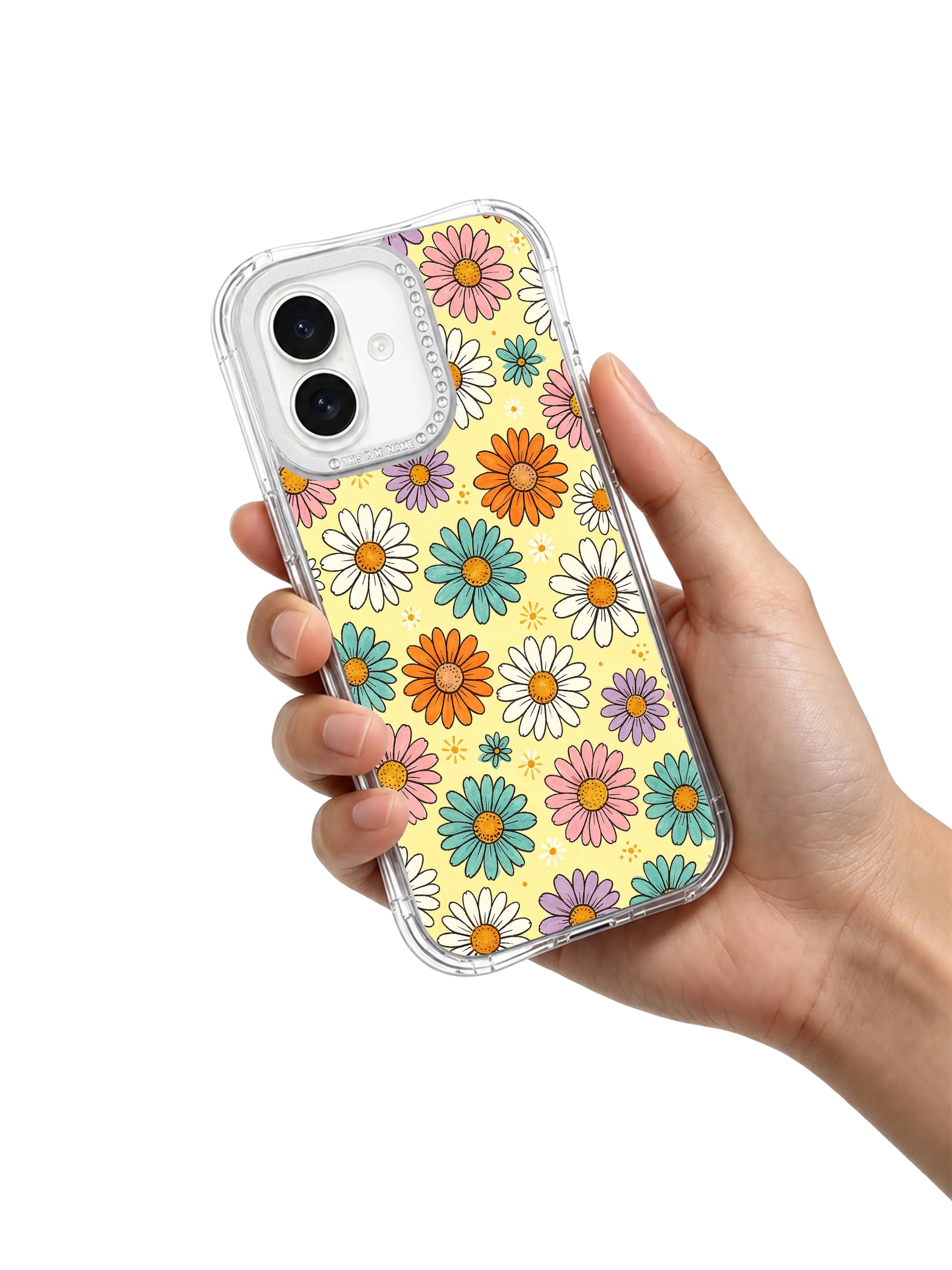 Spring outdoor lifestyle handheld model shot Buttercream Color Bloom iPhone 17 casing from PhoneCasing, upbeat joyful colorful daisy women’s casual daily accessory designed for all-day iPhone 17 carry.
