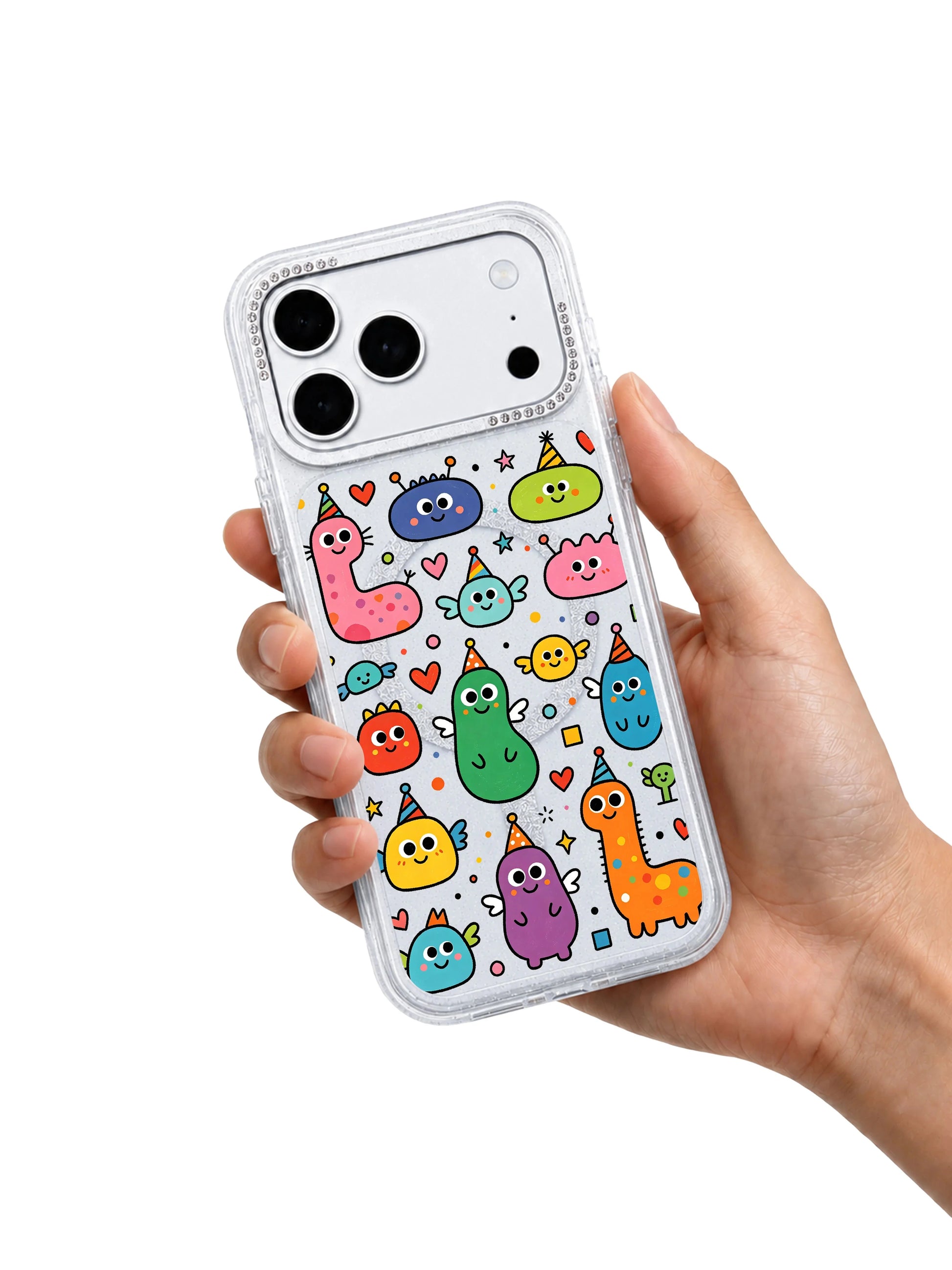 PhoneCasing character macro shot of party hat-wearing cute blob monsters on Heart Monster Village iPhone 17 Pro Max case, Milo Popkins signature whimsical naive doodle style on clear glitter iPhone 17 Pro Max casing