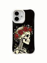 PhoneCasing Night Crown morbid botanical iPhone 16 Case, exclusive Morrigan Vale art with skull crowned by natural red roses and wild white daisies, UV-printed custom printed protective iPhone 16 cover
