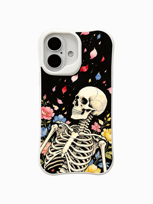 PhoneCasing Night Petal Rain fine art iPhone 16 Case, original Morrigan Vale watercolor goth tattoo artwork featuring upright skeleton with falling multicolor flower petals landing on skull and shoulder against vintage black background, scratch resistant glossy casing made in California