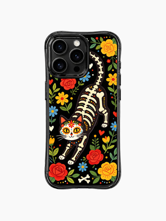 PhoneCasing iPhone 16 pro max Case featuring Estrella Nocturna art: a sugar skull floral skeleton cat prowling through midnight garden with red roses, blue daisies and yellow blooms, Día de los Muertos folk art on black background, durable everyday iPhone 16 pro max casing.