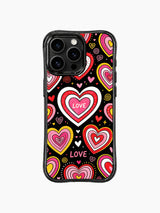 PhoneCasing iPhone 13 Pro Max casing featuring Nova Heartwell’s Rainbow Heart Candy Shop artwork, concentric layered rainbow candy hearts in pink red yellow white, hand-drawn LOVE lettering, tiny mini heart accents, spiral swirl & dot confetti sprinkles on solid black background, sweet playful candy romantic protective phone cover.
