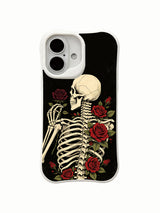 PhoneCasing lifestyle handheld Black Rose Oath iPhone 16 Case, female model holding traditional goth skeleton red rose artwork outdoors, slim lightweight scratch resistant glossy iPhone 16 cover